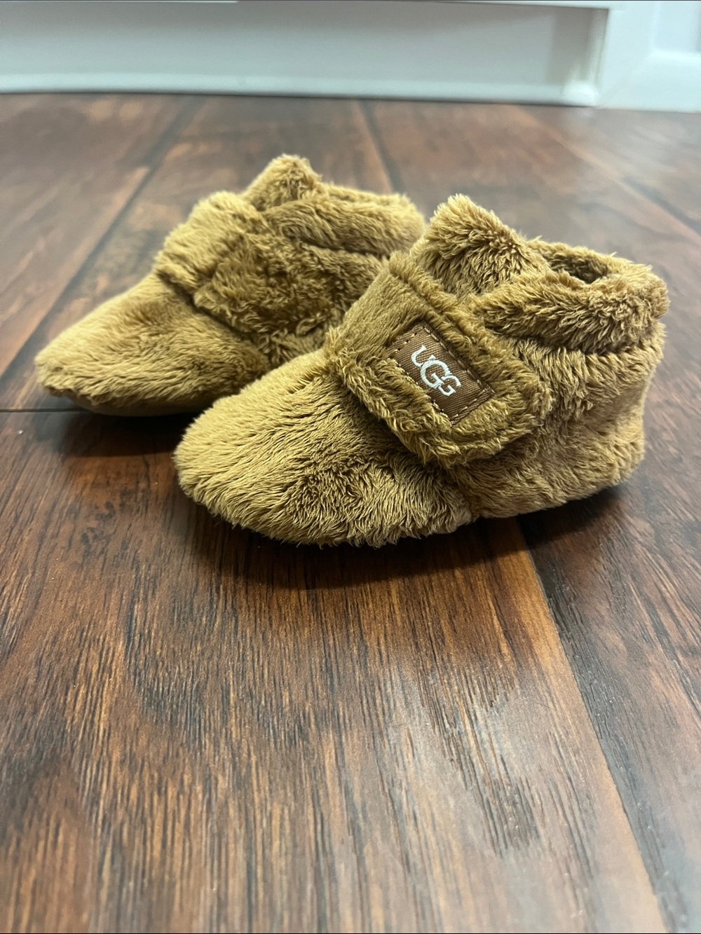 UGG Baby Fuzz Strap Booties in Chestnut